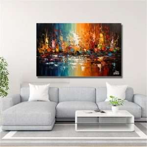 Cuadro decorativo que muestra el reflejo vibrante de un atardecer en el agua, con una mezcla de colores cálidos y fríos.